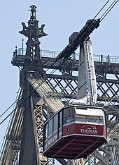 An old tram car crossing the East River, 2005 Roosevelt Island Tramway tower.jpg
