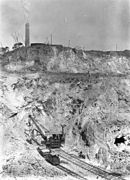 Rail mounted machinery in the Mt Morgan open cut mine, 1908