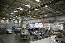 SpaceX Dragon capsules being manufactured at SpaceX's factory Three Dragons on Factory Floor.jpg