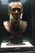 Sander's Hall of Fame bust in Canton, Ohio. The bust is pictured in a glass casing.