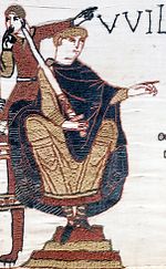 Viljem Osvajalec na tapiseriji iz Bayeuxa v bitki pri Hastingsu, dviga čelado in kaže, da je še vedno živ