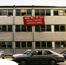 In 1998, shortly before the building's demolition, students added a giant "deactivated" sign, an oversized copy of the sticker attached to decommissioned MIT equipment. Building 20, MIT.jpg