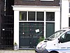 Huis, vanwege de zandstenen afdekkingen van de klokvormige top