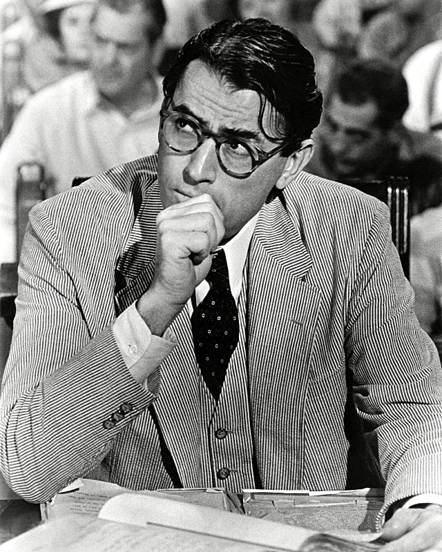 A black and white photograph of Peck as Atticus Finch in To Kill a Mockingbird.