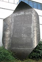 In the Wesleyan Quadrilateral, experience is an additional source of authority. Pictured is a memorial to John Wesley's own experience of the New Birth and Assurance. John Wesley memorial Aldersgate.jpg