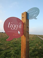 Photograph of phonetic birdsong panels by artist Adrian Riley at RSPB Bempton