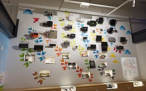 A collection of home video game consoles, arranged in chronological order from bottom to top, at The Finnish Museum of Games, Tampere Suomen Pelimuseo 2.jpg