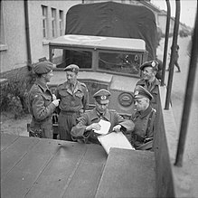 British and German officers after arranging the German handover of the Bergen-Belsen concentration camp and the surrounding area, negotiated during a temporary truce, April 1945 The Liberation of Bergen-belsen Concentration Camp, April 1945 BU4068.jpg