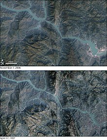 Satellite map showing areas flooded by the Three Gorges reservoir. Compare 7 November 2006 (above) with 17 April 1987 (below). The energy station required the flooding of archaeological and cultural sites and displaced some 1.3 million people, and is causing significant ecological changes, including an increased risk of landslides. The dam has been a controversial topic both domestically and abroad. ThreeGorgesDam-Landsat7.jpg