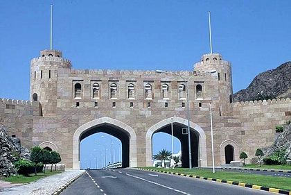 An elegant gateway across a road in Muscat, Oman