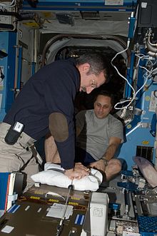 Dan Burbank and Anton Shkaplerov participate in a medical contingency drill in the Destiny laboratory of the International Space Station. This drill gives crew members the opportunity to work as a team in resolving a simulated medical emergency on board the space station. NASA Medical Monitoring 2.jpg