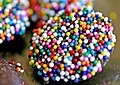 Nonpareils on a piece of chocolate candy