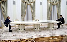 Russian President Vladimir Putin and French President Emmanuel Macron in Moscow on 7 February 2022 Putin and Macron meeting with a large table.jpg