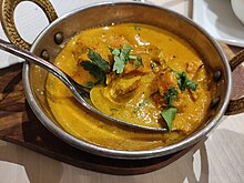 Chicken tikka masala, 1970s, adapted from the Indian chicken tikka and now widely considered "a true British national dish." Taj Mahal - Chicken Tikka Massala.jpg