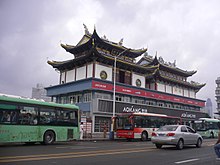 Folk temple on the rooftop of a commercial building in the city of Wenzhou. Temple on the rooftop of a commercial building in Lucheng, Wenzhou, Zhejiang, China.jpg