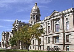 The facade as it was extended during 1915 with the House and Senate chambers in the end pavilions Wyoming Capitol Exterior.jpg