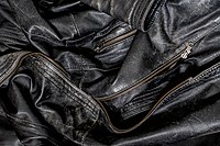 Black worn leather jacket detail