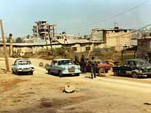 A checkpoint manned by the Lebanese army and US Marines, 1982. The Lebanese Civil War (1975-1990) was characterized by multiple foreign interventions. Checkpoint 4, Beirut 1982.jpg
