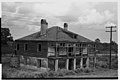 Vue d'une maison abandonnée de la plantation en 1938