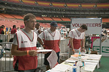 Volunteers assist Hurricane victims at the Houston Astrodome, following Hurricane Katrina. FEMA - 15337 - Photograph by Andrea Booher taken on 09-10-2005 in Texas.jpg