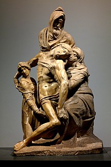 Image d'une sculpture dont les personnages sont représentés dans une composition pyramidale. Un personnage porte dans ses bras le Christ représenté comme une figure serpentine , aidé par la Vierge Marie à droite et Marie-Madeleine à gauche.