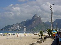 Ipanema beach, in the South Zone, as featured in the Tom Jobim and Vinicius de Morais song The Girl from Ipanema. Pedra de Gvea can be seen in the background.