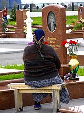 A Beslan mother at the cemetery for victims of the siege (2006) AB Beslan Mother.jpg