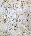 Suppedaneum figuré dans le graffiti d'Alexamenos (représentation de la crucifixion de Jésus entre le Ier siècle et le IIIe siècle) ?