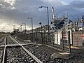 Westbound view in November 2022, with works for the station rebuilding and level crossing removal in the background.