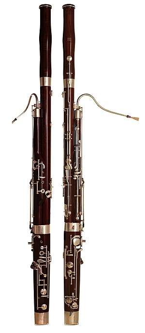 Two bassoons made of black maple, with silver-...
