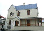 A double storey house forming an integral part, of the Old Grey Institute group of buildings. The building is noted for its twin gables, wrap-around veranda, tracery and entrance porch. Architectural style: Victorian house. Type of site: House.