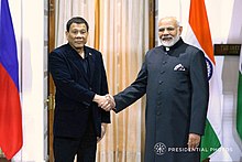 Rodrigo Duterte of the Philippines and Narendra Modi of India, 2018. They are both considered populist leaders of the left and right, respectively. President Rodrigo Roa Duterte poses for a photo with Indian Prime Minister Narendra Modi prior to the start of the bilateral meeting at the Hyderabad House in New Delhi.jpg