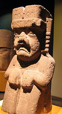 Monument 52 from San Lorenzo Tenochtitlan. Some researchers identify this figure as the were-jaguar while others state that it instead represents the Rain Deity. The long deep groove carved into the back of this basalt sculpture indicates it was part of the drainage system. Seated Olmec Jaguar from San Lorenzo, Veracruz.jpg