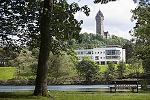 Airthrey Loch, the university's Cottrell Building and the Wallace Monument. University of Stirling campus.jpg