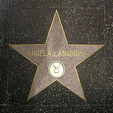 A five-point star set in the ground; the name "Angela Lansbury" is written in the centre of it in gold lettering