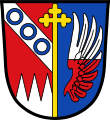 Gemeinde Großeibstadt Durch einen goldenen Kreuzstab gespalten von Rot und Blau; vorne über drei gesenkten silbernen Spitzen ein silberner Schrägbalken, belegt mit drei blauen Ringen, hinten ein von Silber und Rot geteilter Flug.