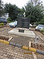The Genocide Monument of the University of Rwanda in a parking lot, Kigali.