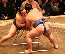 A sumo match (tori-kumi) between yokozuna Asashōryū (left) and komusubi Kotoshōgiku in January 2008.