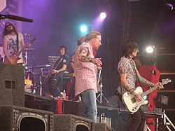 Guns N' Roses in 2006. From left to right: Robin Finck, Tommy Stinson, Axl Rose, Richard Fortus