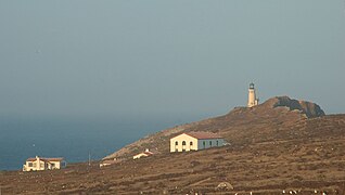 Lighthouse and National Park structures at sunset.