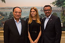 Houlin Zhao, Princess Beatrice and Tedros Adhanom at a UN Broadband Commission Dinner, September 2017 Houlin Zhao, Beatrice of York & Tedros Adhanom Ghebreyesus (36433272754).jpg