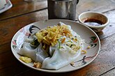 Khao phan phak, a variation with stir-fried vegetables