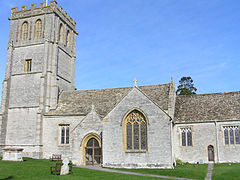 Stone building with square tower.