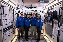 Four astronauts inside of the Gateway mock-up module at the Space Station Processing Facility in the Kennedy Space Center, Florida LOP-G interior with Astronauts.jpg