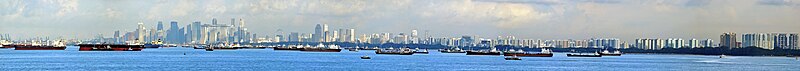 Ships in the ocean with Singapore visible in the background