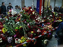 Commuters leave flowers at the Park Kultury station Park Kultury. Flowers1. 30-03-2010.jpg