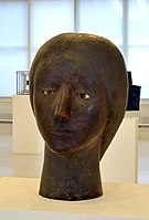 Head, 1957, patinated plaster, glass