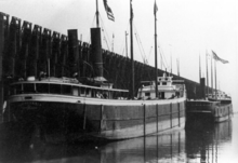 Stern view of the Australasia at an ore dock Australasia ship.png