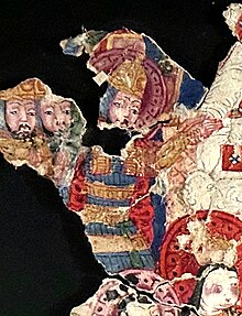 Bogu Qaghan, the third Khagan of the Uyghur Khaganate, in a suit of armour; 8th century Manichean manuscript (MIK III 4979) Conversion of Bogu Qaghan (759-780 CE) to Manicheism in 762 (detailed of Bogu Qaghan in a suit of armour, kneeling to a Manichean high priest).jpg