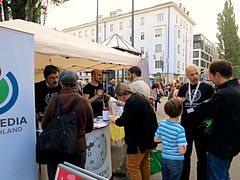 Volunteers explaining Wikipedia